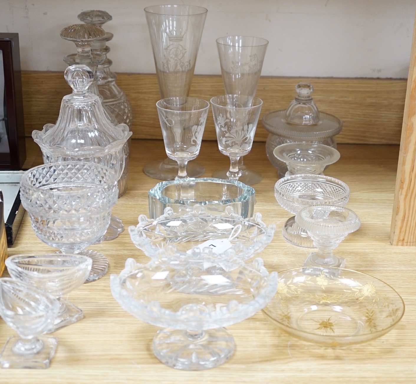 A collection of 19th century hobnail-cut salts, pots, jars and a pair of decanters, etched glasses, etc.